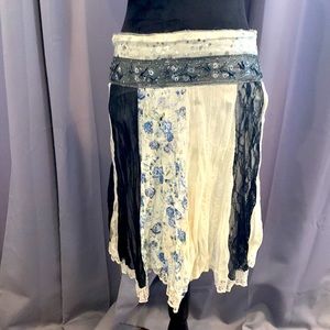 CELLE lace trim skirt with floral, black and white lace sections. Size Medium.